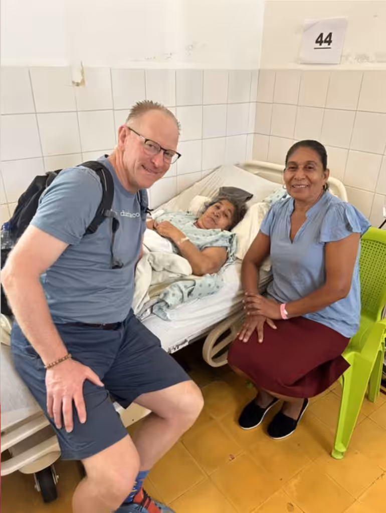 Dr. Berend sitting with a female Guatemalan patient